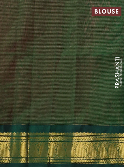 Silk cotton saree dark peach and bottle green with plain body and paisley zari woven korvai border