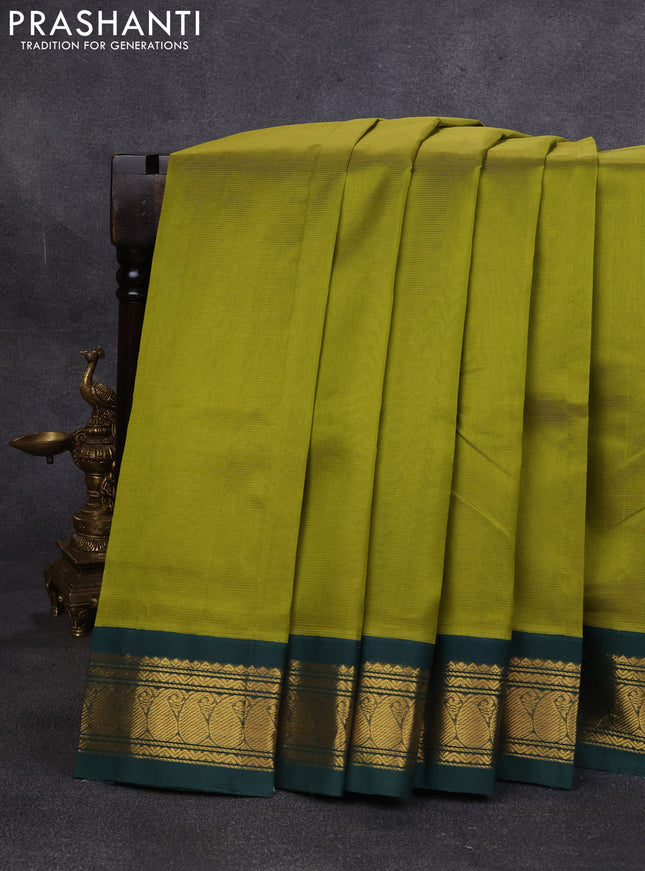 Silk cotton saree mehendi green and bottle green with plain body and paisley zari woven korvai border