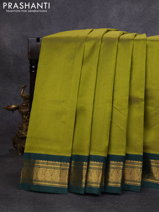 Silk cotton saree mehendi green and bottle green with plain body and paisley zari woven korvai border