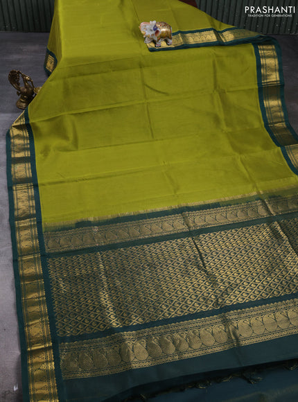Silk cotton saree mehendi green and bottle green with plain body and paisley zari woven korvai border