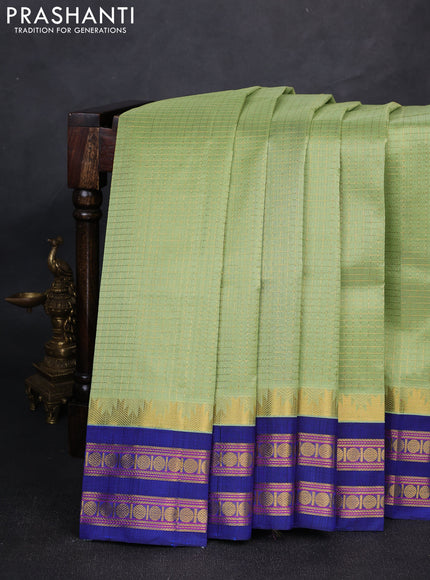Silk cotton saree pista green and navy blue with allover zari checked pattern and temple design rettapet zari woven korvai border