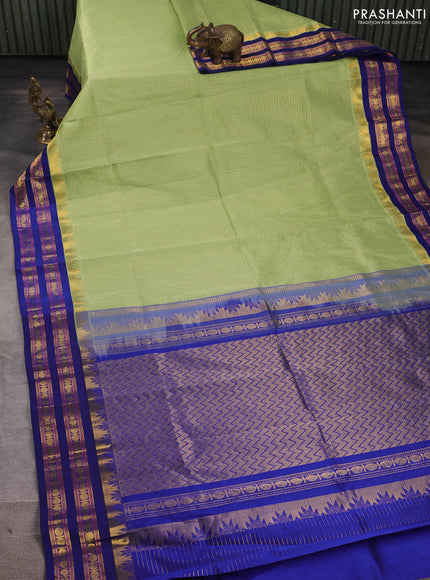Silk cotton saree pista green and navy blue with allover zari checked pattern and temple design rettapet zari woven korvai border