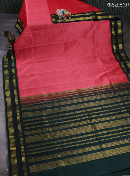 Silk cotton saree dark peach and bottle green with plain body and temple design rettapet zari woven korvai border