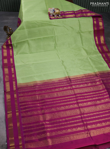Silk cotton saree pista green and purple with plain body and temple design rettapet zari woven korvai border