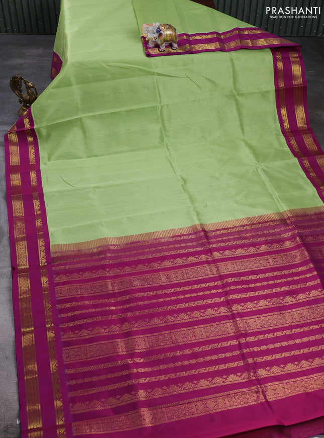 Silk cotton saree pista green and purple with plain body and temple design rettapet zari woven korvai border