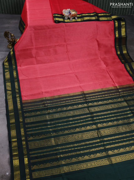 Silk cotton saree dark peach and bottle green with plain body and temple design rettapet zari woven korvai border