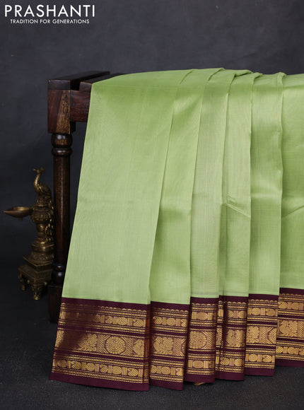 Silk cotton saree pista green and wine with plain body and zari woven butta korvai border