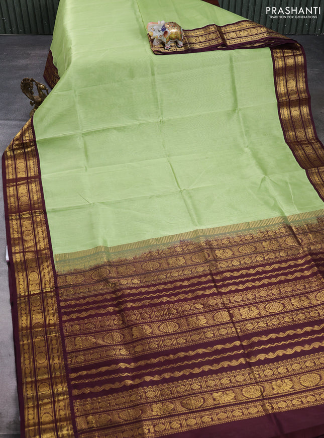 Silk cotton saree pista green and wine with plain body and zari woven butta korvai border