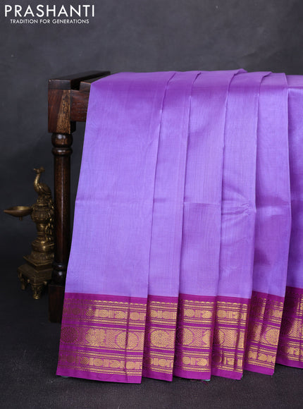 Silk cotton saree lavender and purple with plain body and zari woven butta korvai border