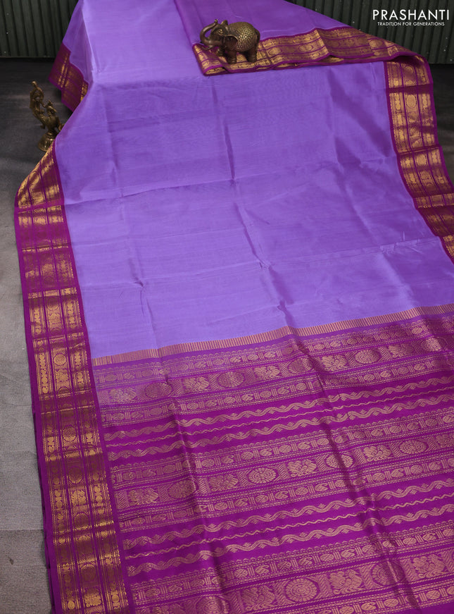 Silk cotton saree lavender and purple with plain body and zari woven butta korvai border