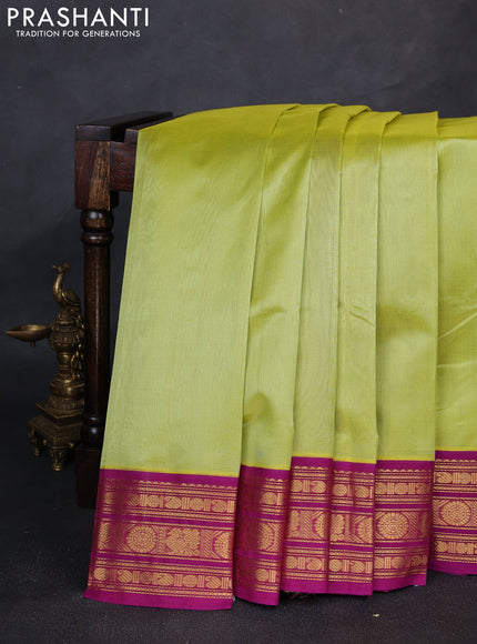 Silk cotton saree pista green and purple with plain body and zari woven butta korvai border