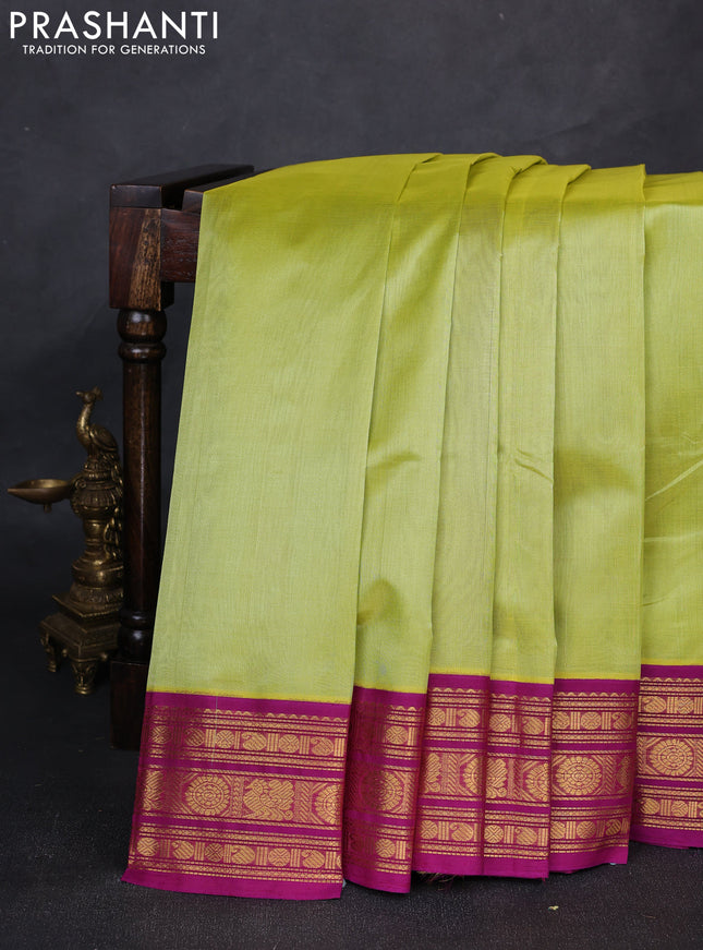 Silk cotton saree pista green and purple with plain body and zari woven butta korvai border