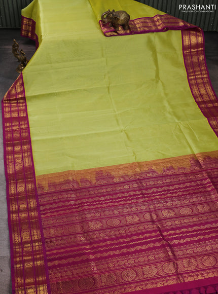 Silk cotton saree pista green and purple with plain body and zari woven butta korvai border