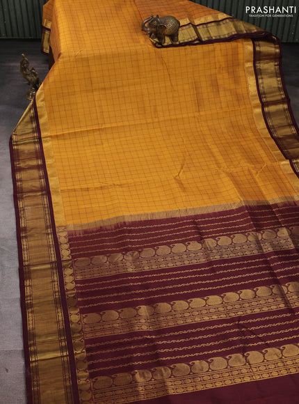 Silk cotton saree mustard yellow and deep maroon with allover thread checked pattern and paisley butta zari woven korvai border