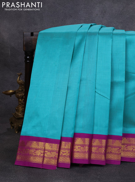 Silk cotton saree teal green and purple with plain body and temple design zari woven korvai border