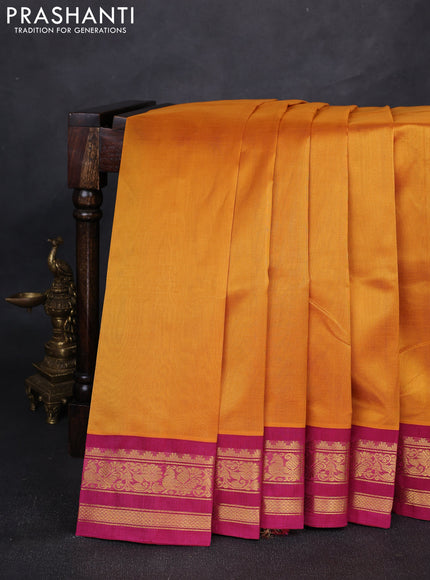 Silk cotton saree mango yellow and pink with plain body and temple design zari woven korvai border