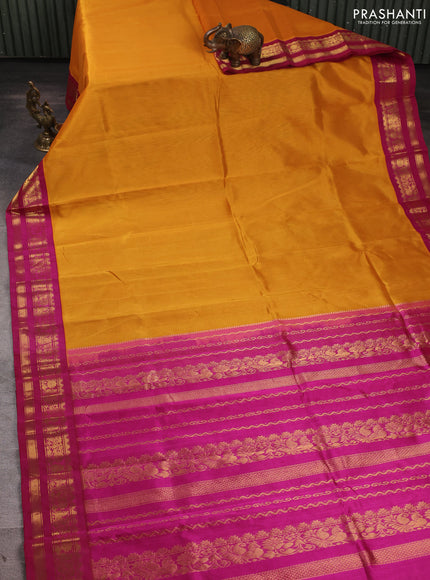 Silk cotton saree mango yellow and pink with plain body and temple design zari woven korvai border