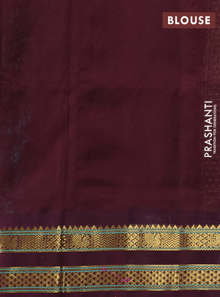 Silk cotton saree teal green and deep maroon with plain body and temple design zari woven korvai border