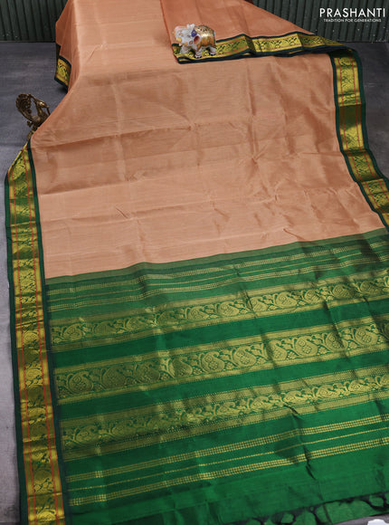 Silk cotton saree sandal and green with plain body and paisley zari woven korvai border