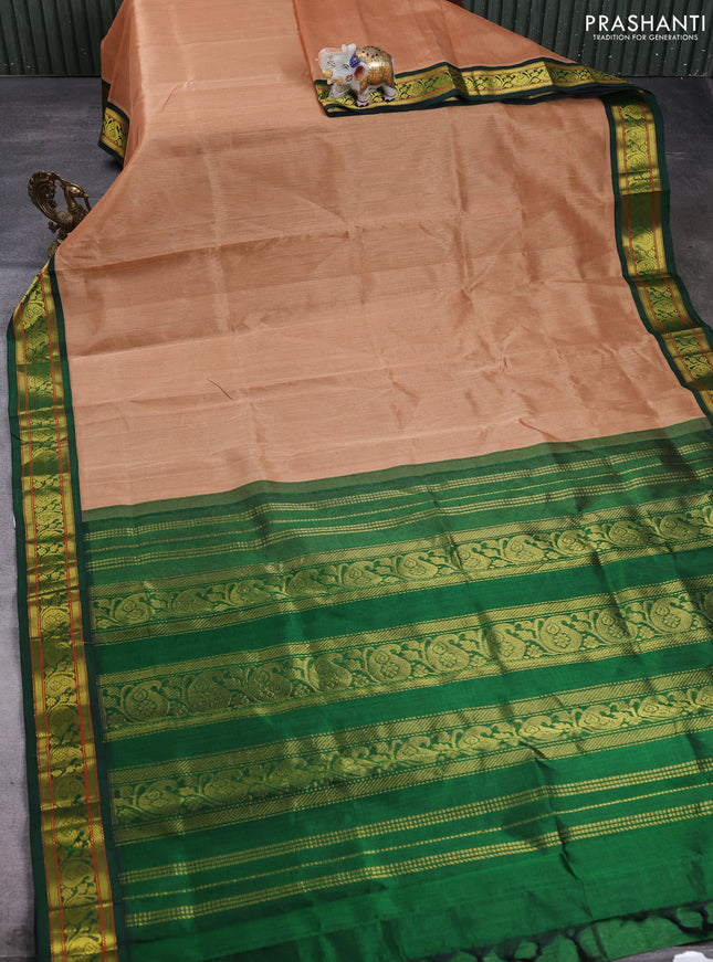 Silk cotton saree sandal and green with plain body and paisley zari woven korvai border