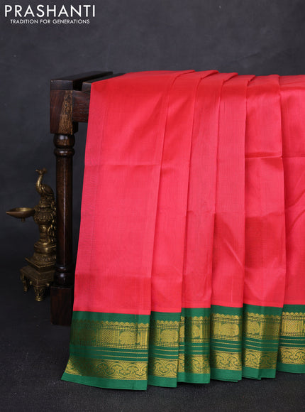 Silk cotton saree dark peach and green with plain body and zari woven korvai border