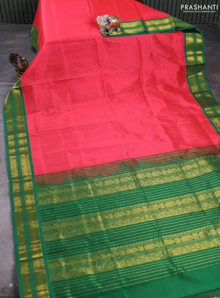 Silk cotton saree dark peach and green with plain body and zari woven korvai border