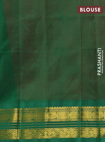 Silk cotton saree dark peach and green with plain body and zari woven korvai border
