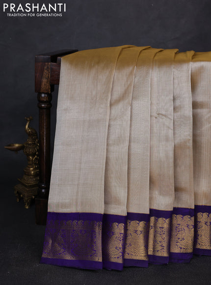 Silk cotton saree beige and violet with plain body and zari woven korvai border