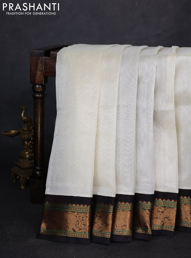 Silk cotton saree off white and deep maroon with plain body and zari woven elephant korvai border