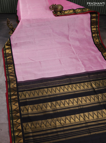 Silk cotton saree light pink and black with plain body and temple design zari woven korvai border