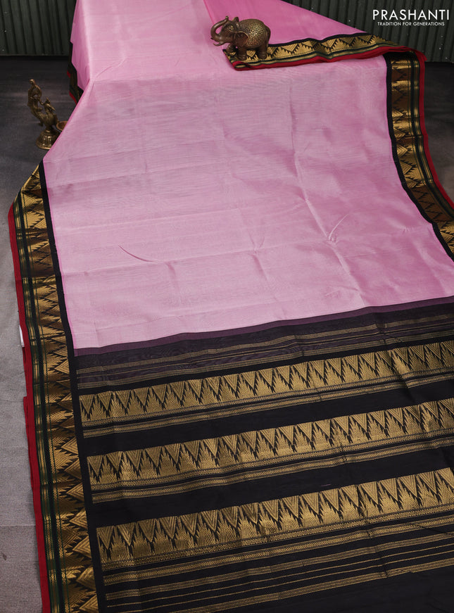 Silk cotton saree light pink and black with plain body and temple design zari woven korvai border
