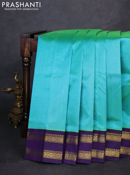 Silk cotton saree dual shade of teal green and violet with plain body and rettapet zari woven korvai border