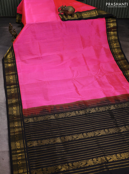 Silk cotton saree dark peach and black with plain body and zari woven korvai border
