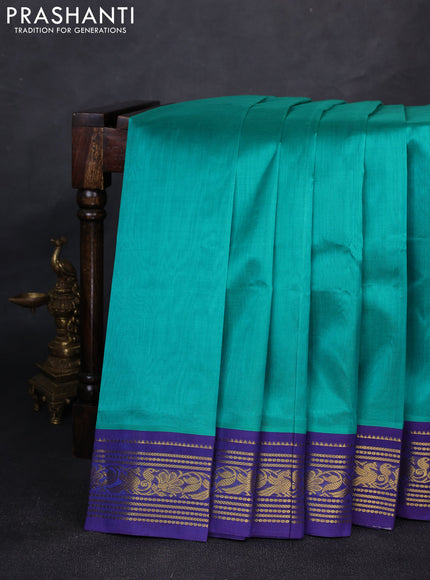 Silk cotton saree teal green and navy blue with plain body and zari woven korvai border