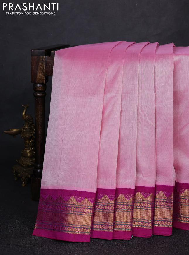 Silk cotton saree light pink and purple with plain body and temple design zari woven korvai border