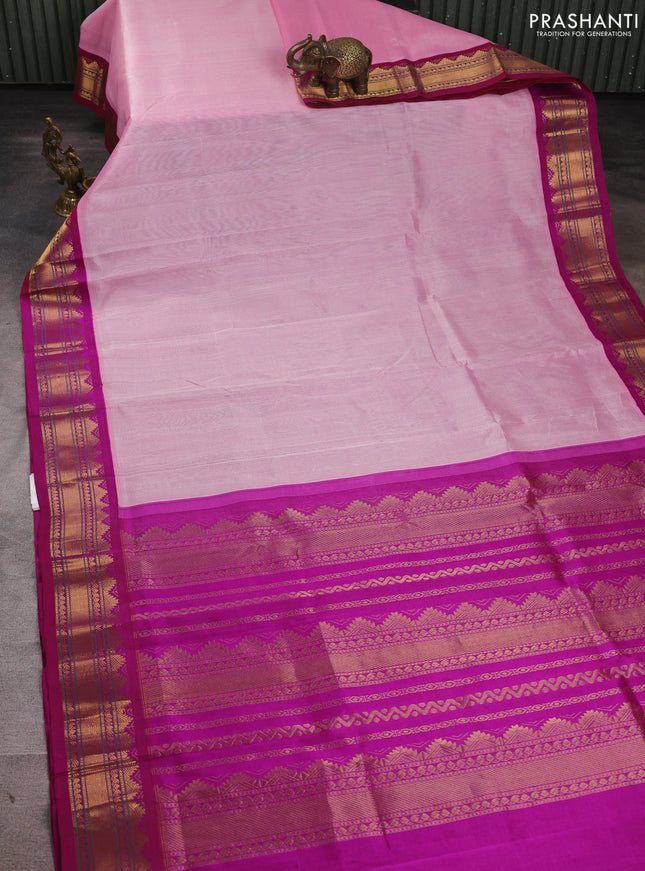 Silk cotton saree light pink and purple with plain body and temple design zari woven korvai border