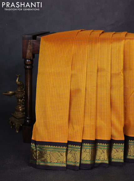 Silk cotton saree mango yellow and deep jamun with allover small zari checked pattern and zari woven korvai border