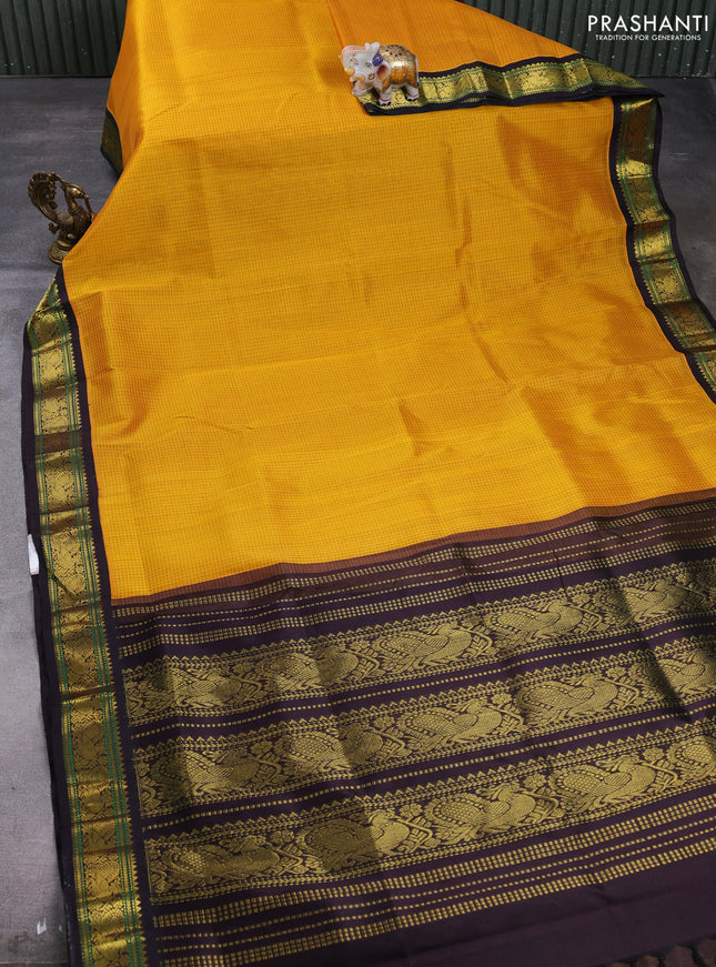 Silk cotton saree mango yellow and deep jamun with allover small zari checked pattern and zari woven korvai border