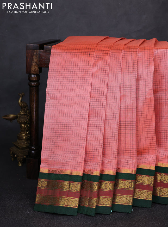 Silk cotton saree peach and bottle green with allover small zari checked pattern and zari woven korvai border