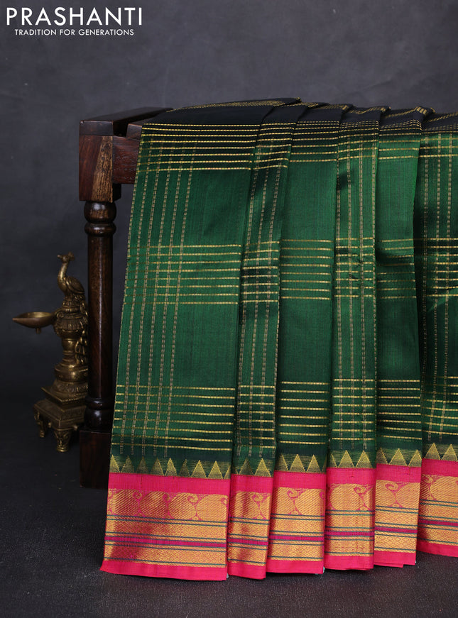 Silk cotton saree bottle green and pink with allover zari checked pattern and paisley zari woven korvai border