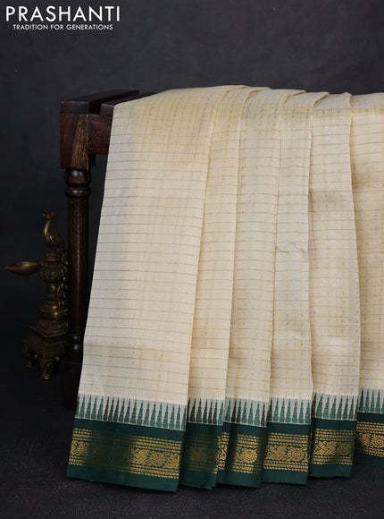 Silk cotton saree cream and bottle green with allover zari checks & laksha deepam buttas and temple design zari woven korvai border