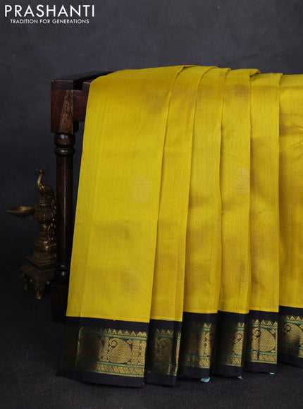 Silk cotton saree lime yellow and black with allover paisley zari woven buttas and paisley zari woven korvai border