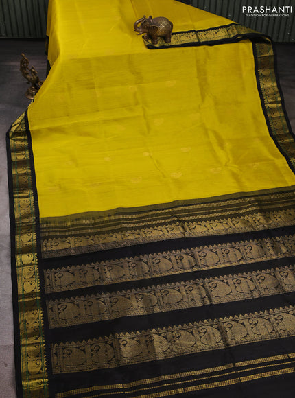 Silk cotton saree lime yellow and black with allover paisley zari woven buttas and paisley zari woven korvai border