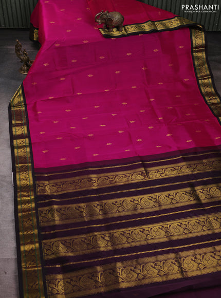 Silk cotton saree pink and deep wine with allover zari woven buttas and paisley zari woven korvai border