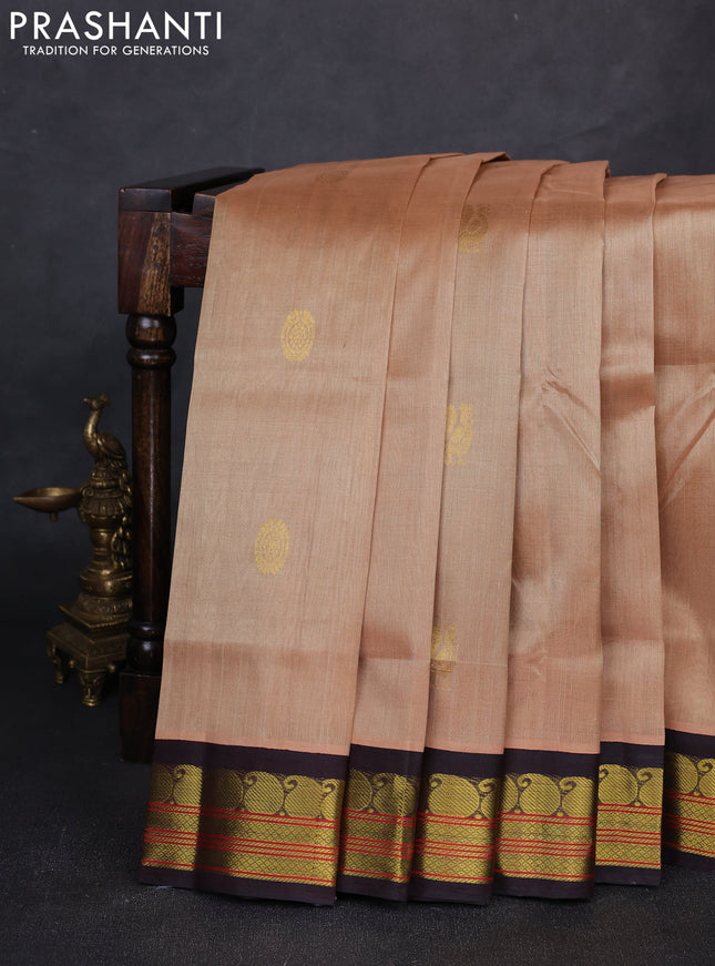 Silk cotton saree beige and coffee brown with allover peacock zari woven buttas and paisley zari woven korvai border