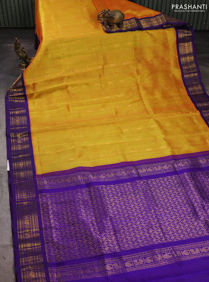 Silk cotton saree sunset orange and violet with allover zari woven buttas and zari woven korvai border