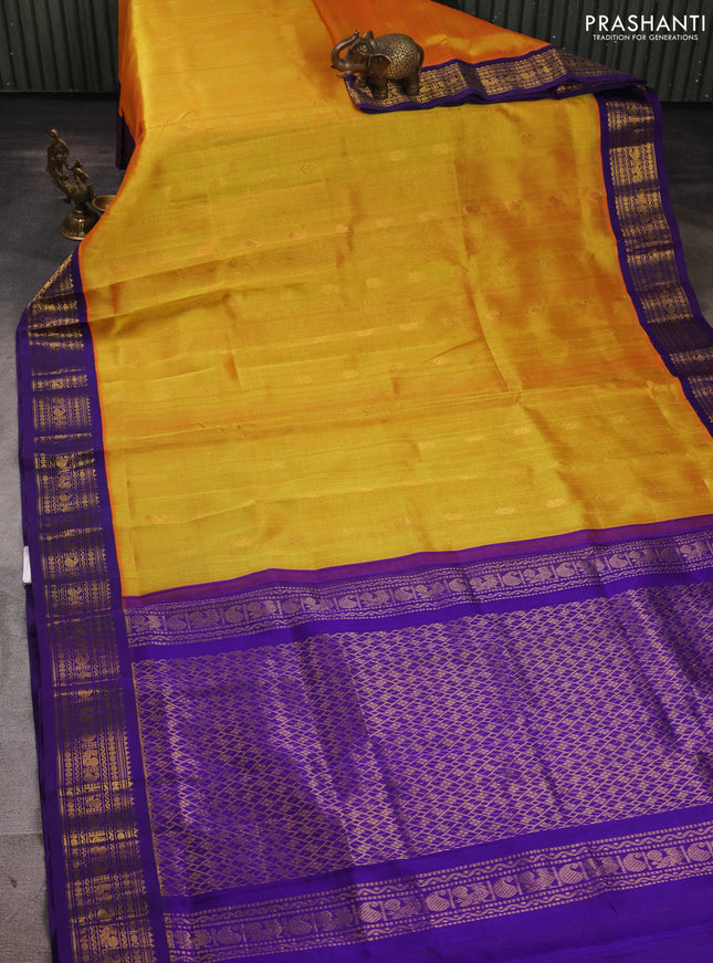 Silk cotton saree sunset orange and violet with allover zari woven buttas and zari woven korvai border