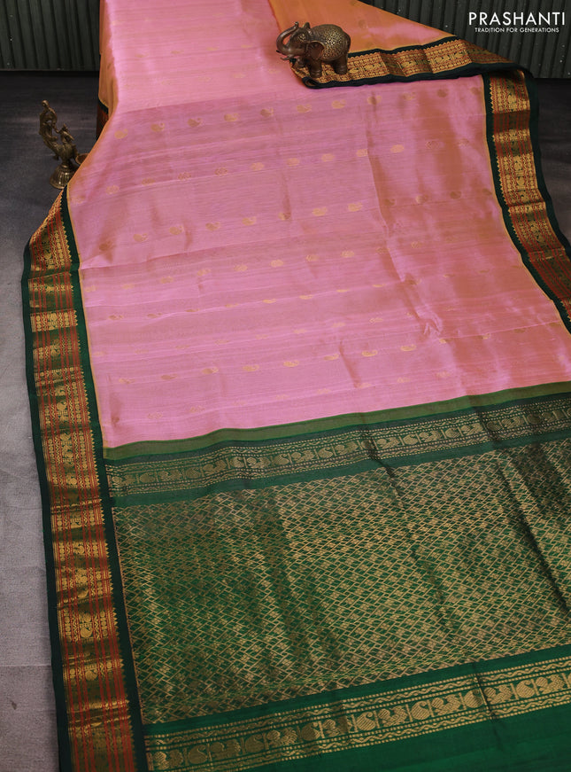 Silk cotton saree pink shade and bottle green with allover zari woven buttas and zari woven korvai border
