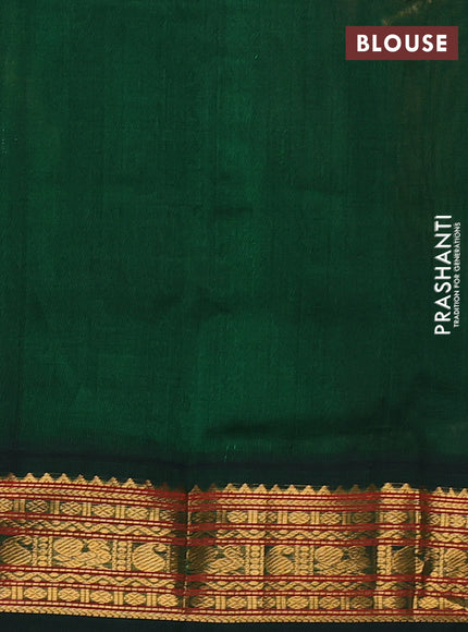 Silk cotton saree pink shade and bottle green with allover zari woven buttas and zari woven korvai border