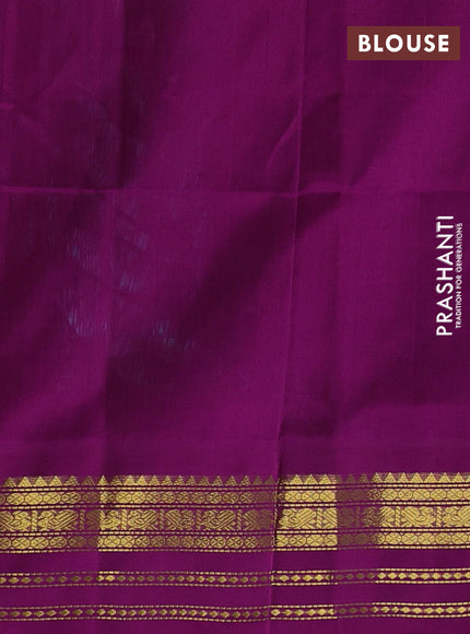 Silk cotton saree dual shade of teal blue and purple with peacock zari woven buttas and zari woven korvai border